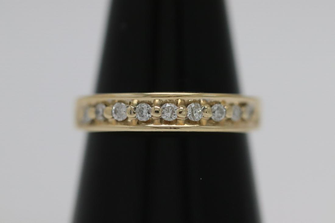 14K Y/G diamond ring: 14K Y/G ring set with 9 brilliant cut diamonds, tdw approx. 0.20ct, size 6.25