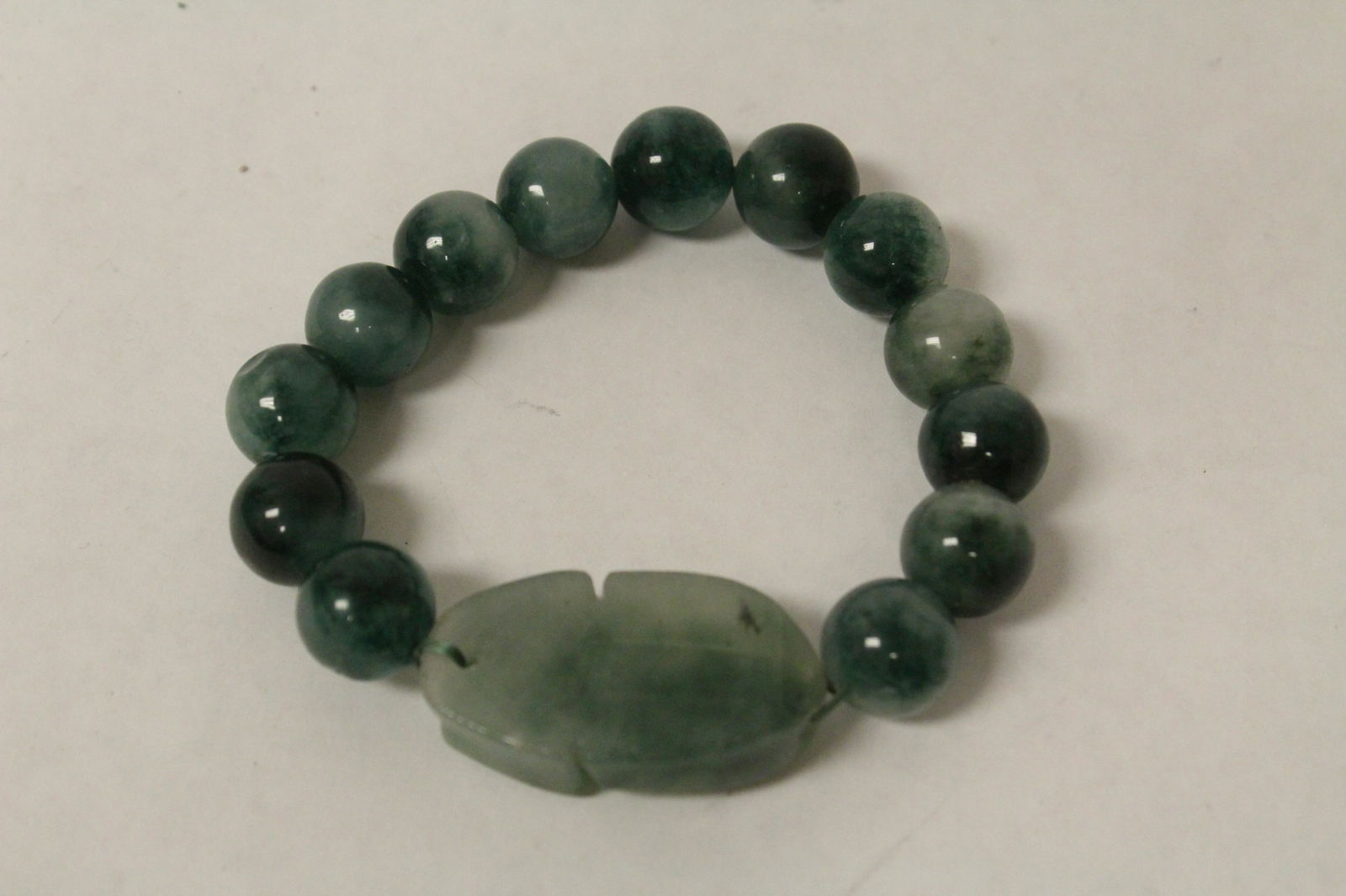 A fine translucent apple green jadeite bracelet (1 of 10)