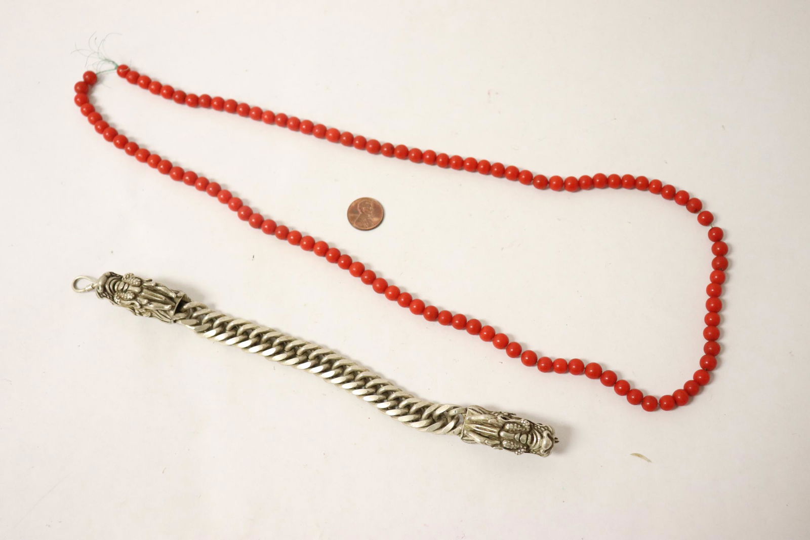 Coral like bead necklace and a silver like bracelet (1 of 9)