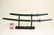 2 contemporary samurai swords on stand