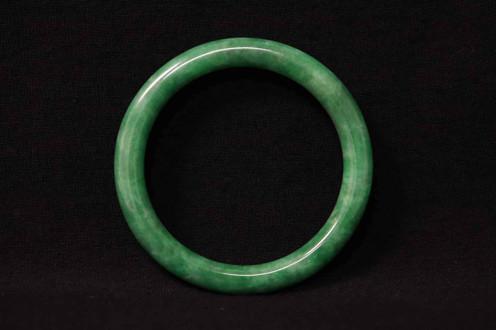 A beautiful apple green jadeite carved bangle (1 of 9)