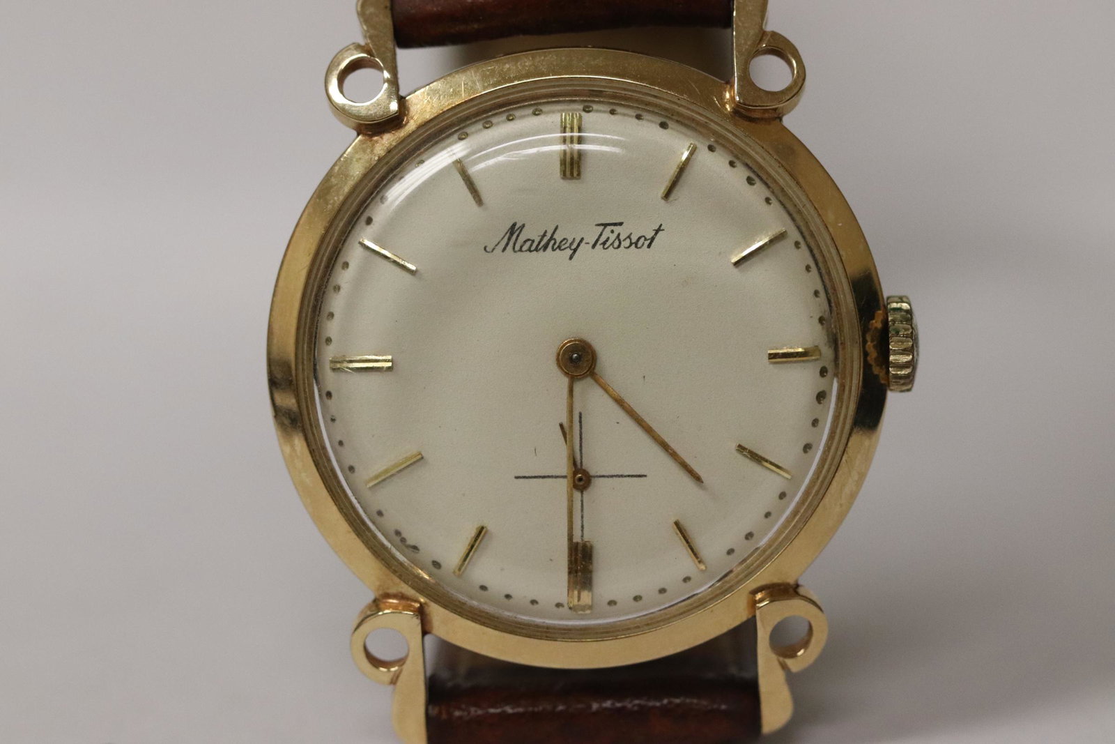 A 14K Y/G Mathey Tissot watch with unusual lug: A 14K Y/G Mathey Tissot man's wrist watch with unusual lug, it works, no guarantee to keep accurate time