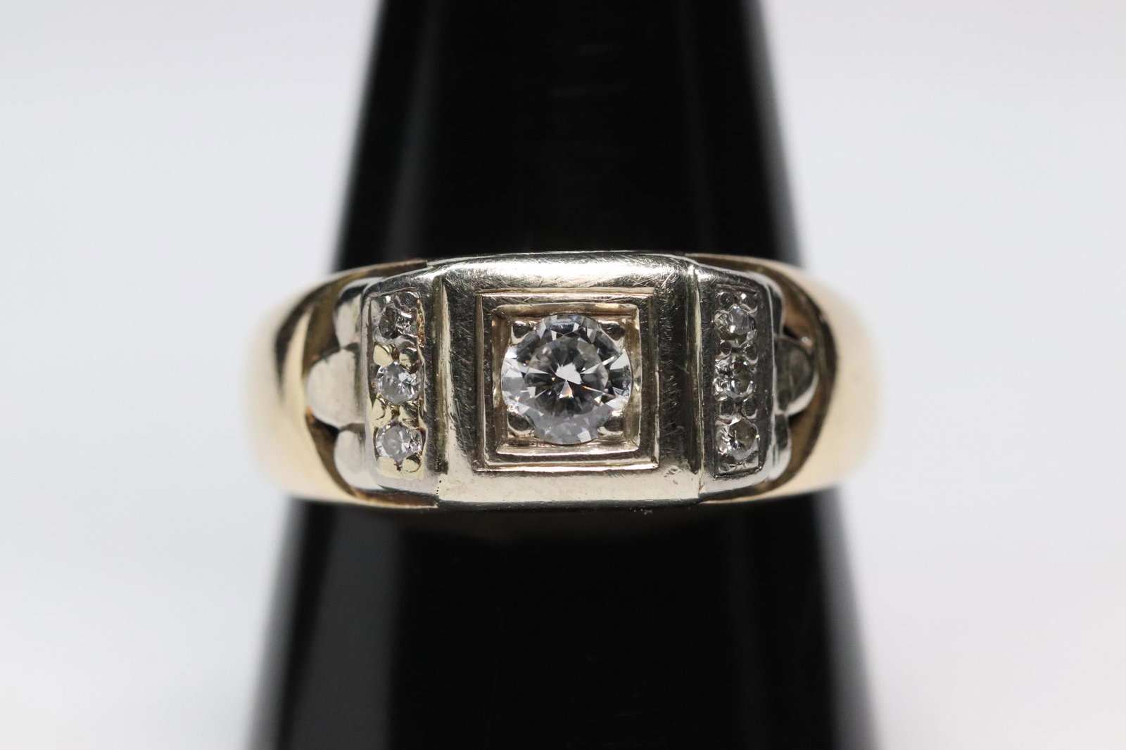 14K Y/G diamond ring: 14K Y/G diamond ring, center fine quality brilliant cut diamond wt. approx. 0.53ct, accented by 6 small brilliant cut diamonds, tdw approx. 0.65ct, wt. 6.1gm, size 10