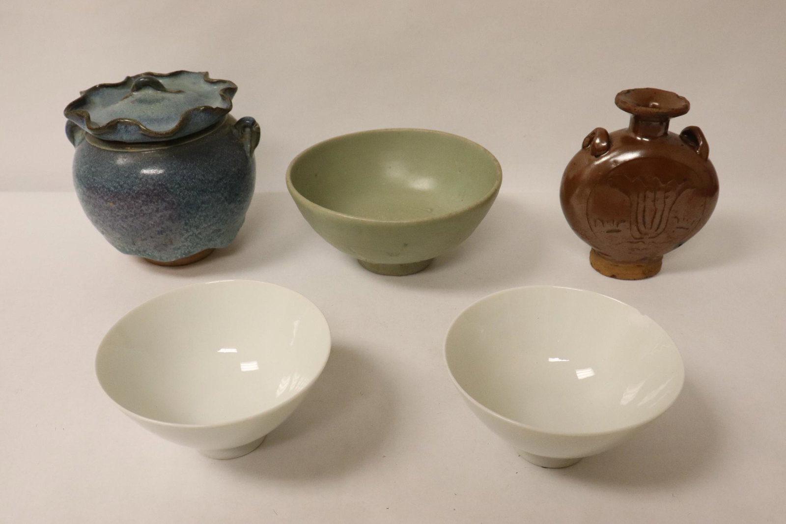 5 misc. Song style pieces: 3 Song style bowls (2.4"Hx4.5"dia(2), 2.83"Hx5.85"dia), edge chip, Song style brown glazed flask (top rim chip, 4.95"Hx4.2"x1.8"), and a Song style blue glazed covered jar (5.35"Hx5.4"x4.95")