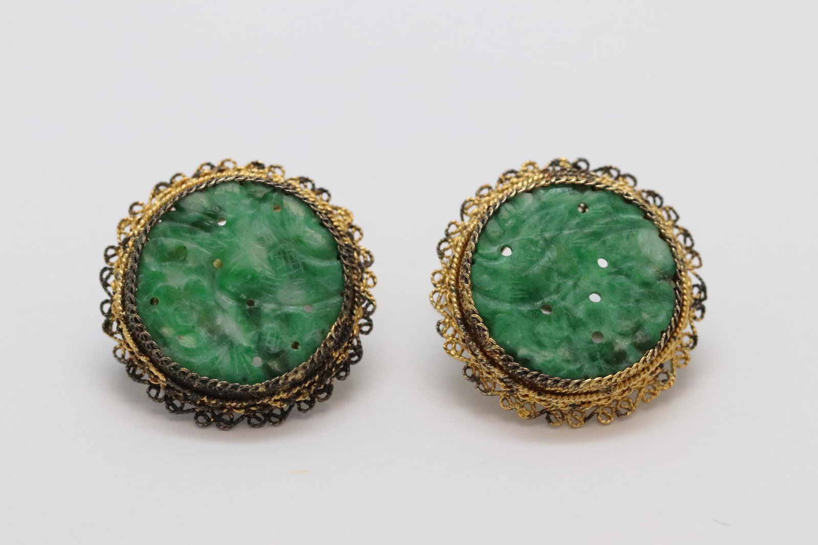 Pair Chinese antique silver jadeite earrings: Pair Chinese antique silver earrings, each set with an apple green jadeite disc measures approx. 17.5mm diameter