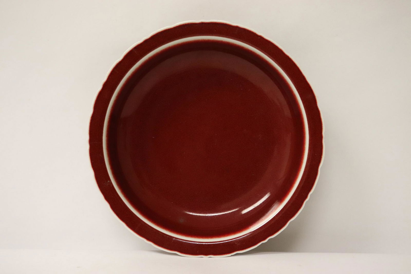 A red glazed porcelain plate (1 of 8)