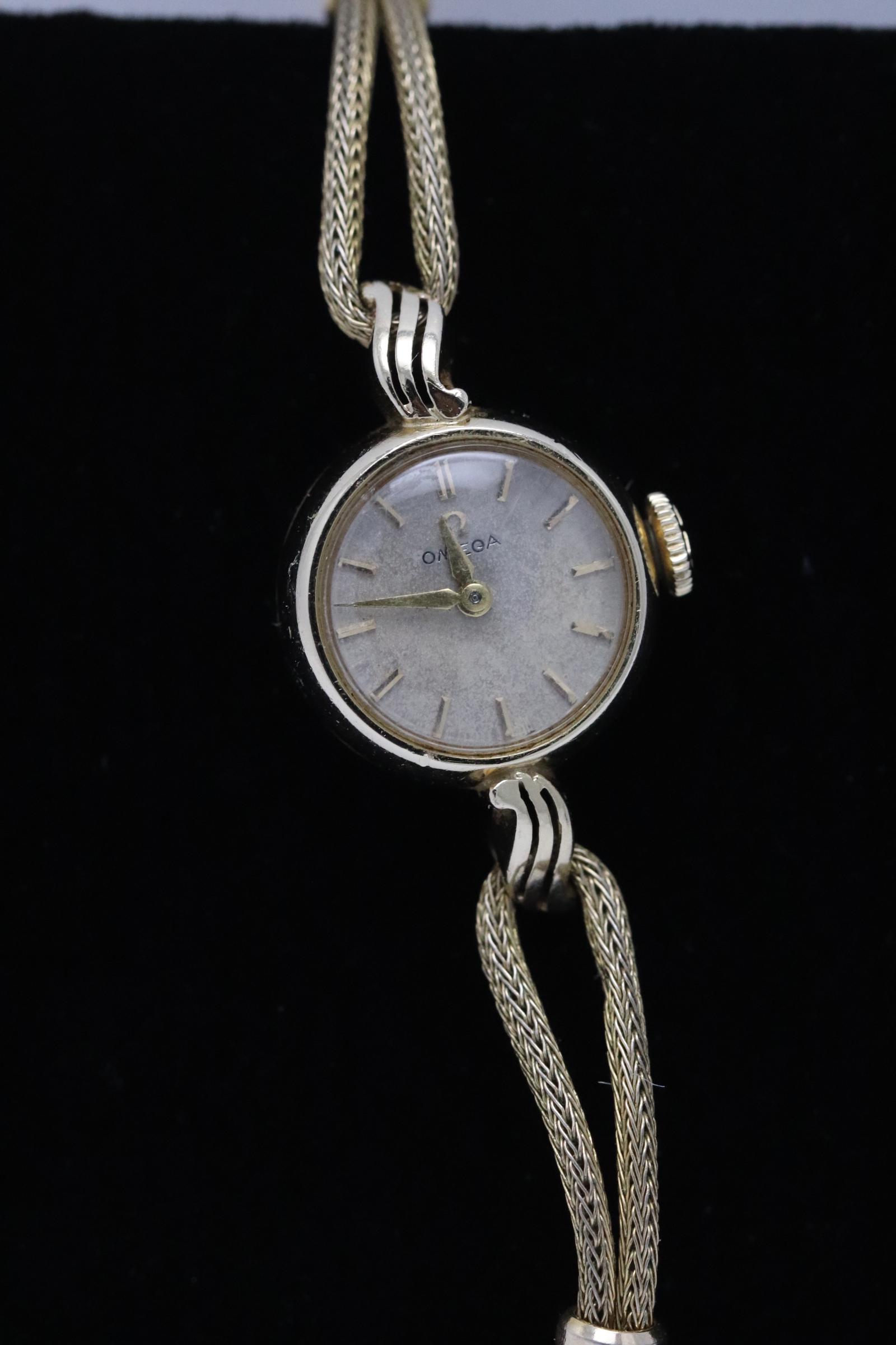 14K Y/G Omega wrist watch w/ gold filled band: 14K Y/G lady's Omega wrist watch with gold filled band