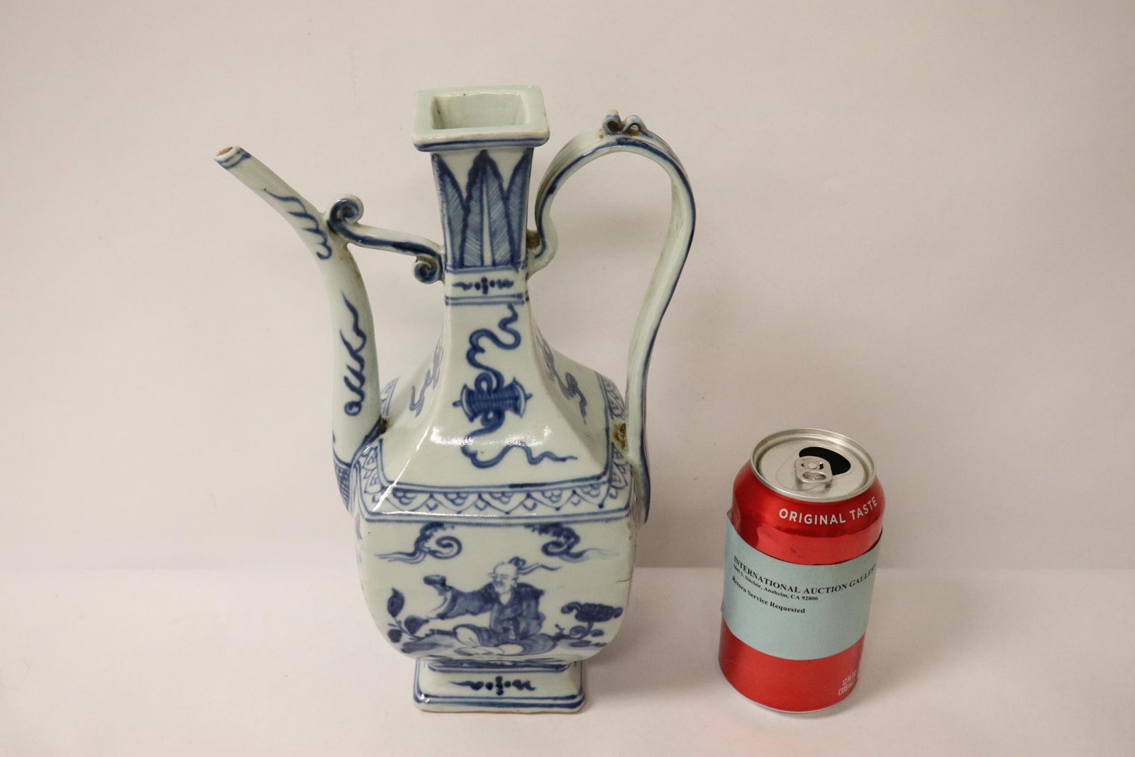 A blue and white porcelain wine server: A blue and white porcelain wine server, 11"Hx7.25"x4.5"