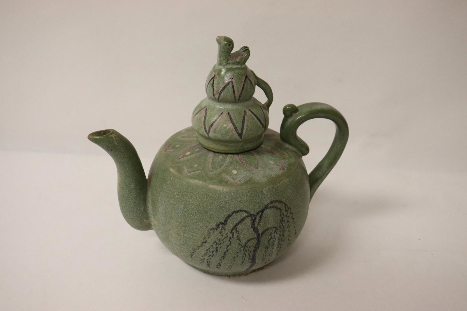 A Korean celadon teapot: A Korean celadon teapot, 7"Hx7.75"x4.8"