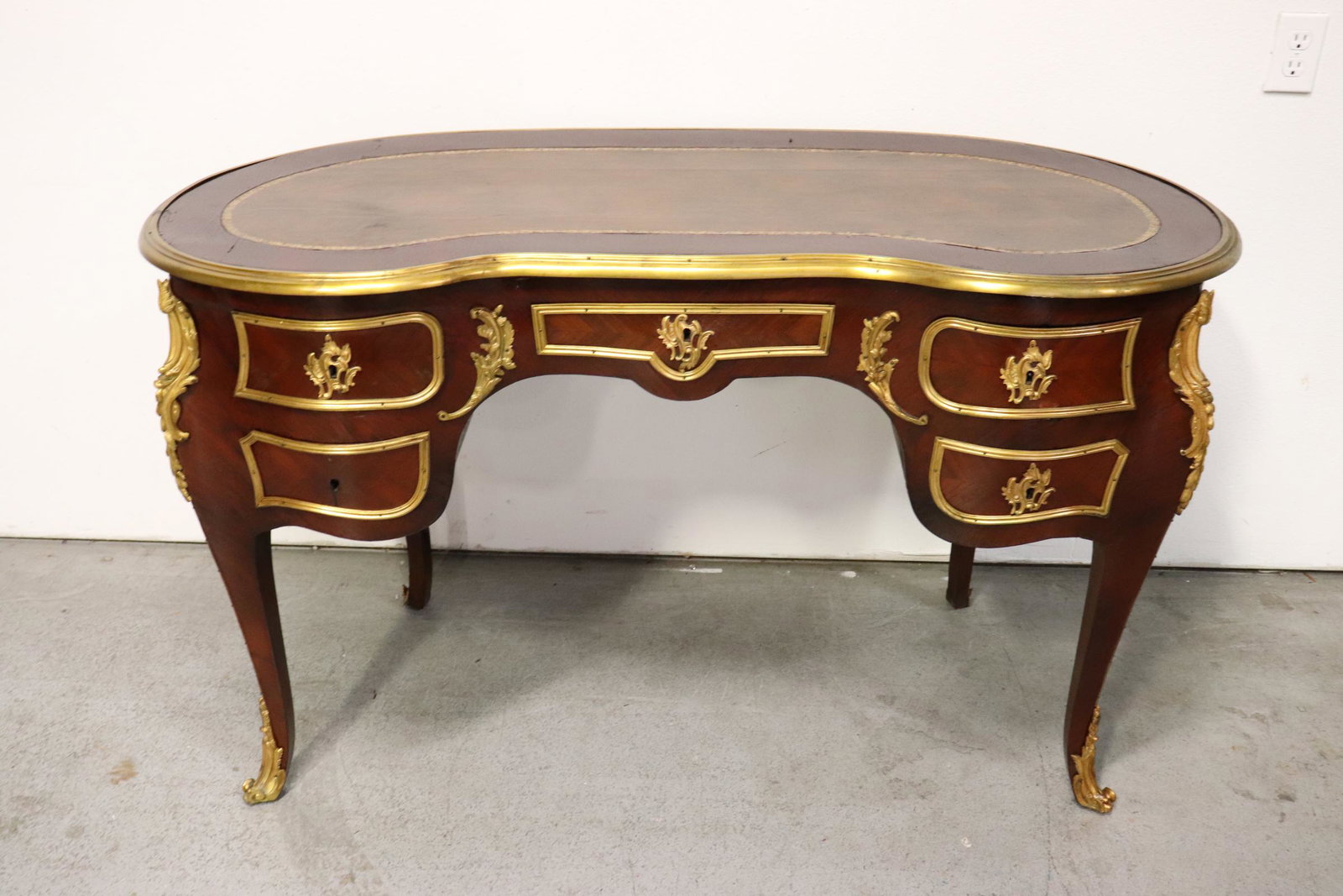 French mahogany desk with gilt bronze ormolu: A beautiful French mahogany desk with gilt bronze ormolu, 32.25"Hx54.4"x25.25"