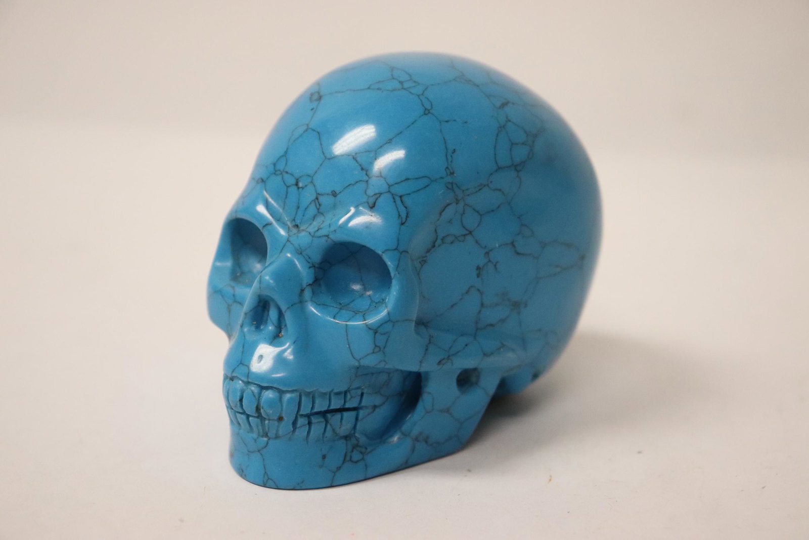 Turquoise like stone carved skull (1 of 8)