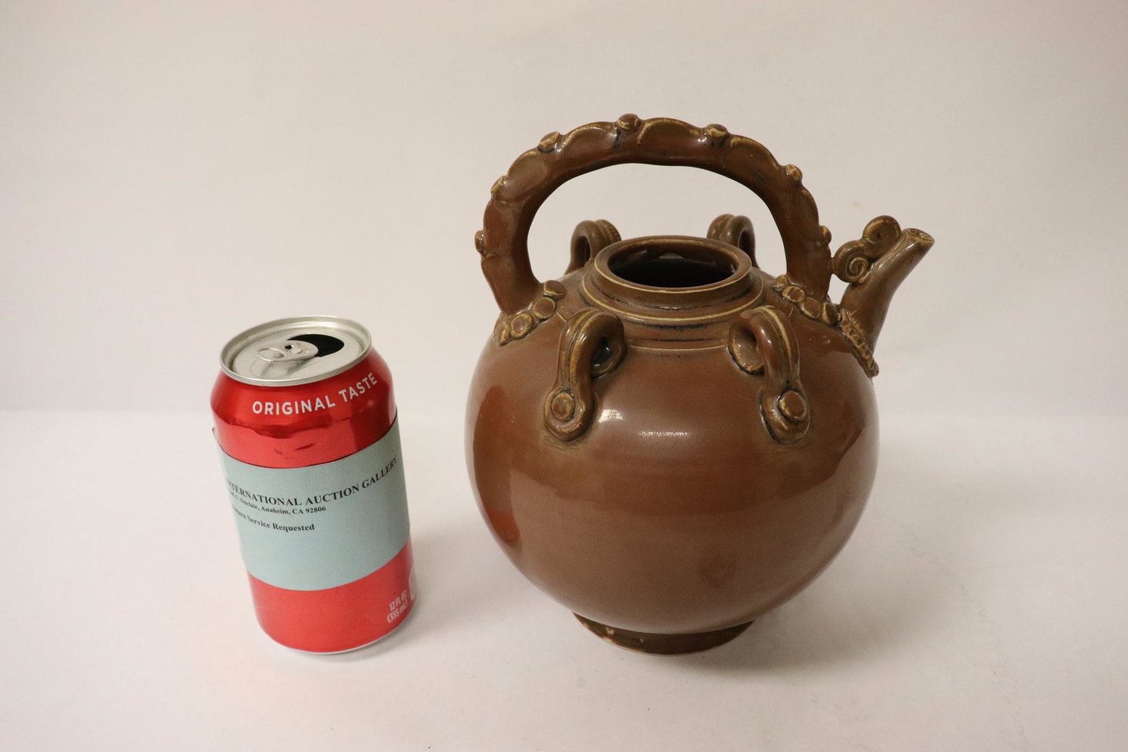 Brown glazed teapot: Brown glazed teapot (no cover), 7.95"Hx6.75"x5.8"
