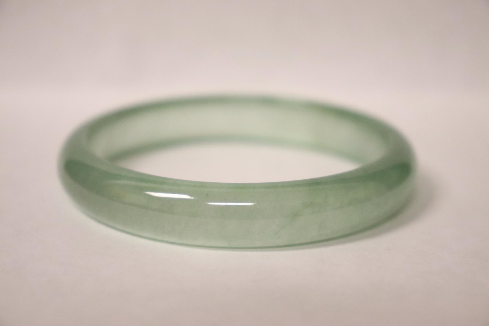 A jadeite like bangle: A jadeite like bangle, 0.43"x2.75"od(2.25"id)