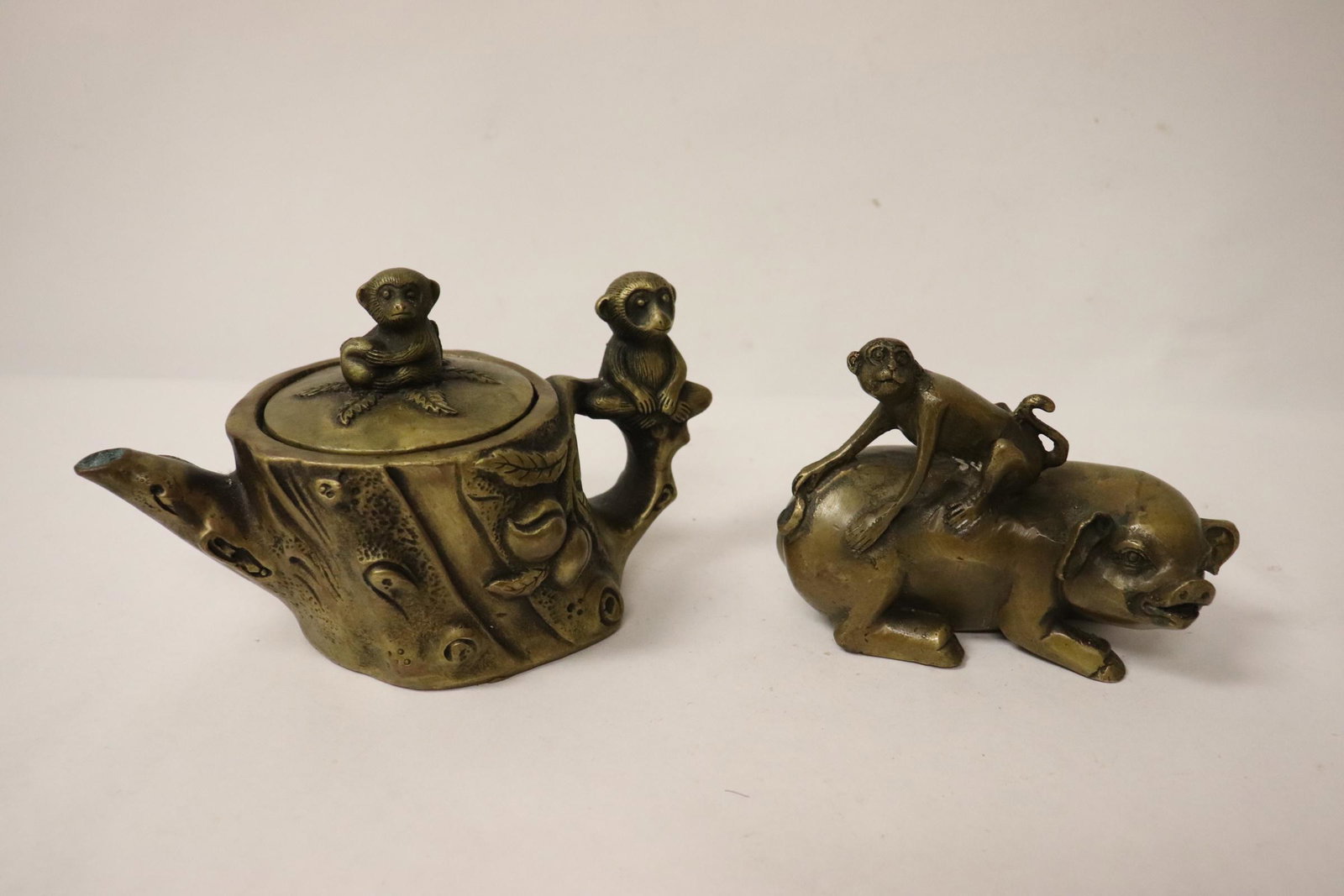 2 bronze pieces; a teapot and an ornament: 2 bronze pieces; a teapot (4.25"Hx7"x3.5") and an ornament (3.7"H)
