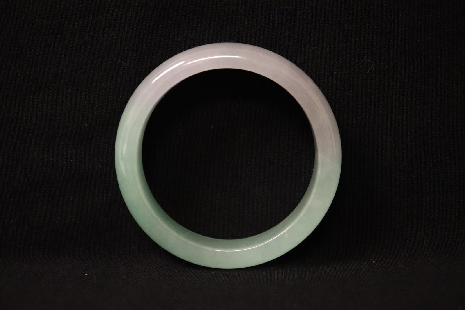 A jadeite like bangle: A jadeite like bangle, 0.6"x2.9"od(2.25"id)