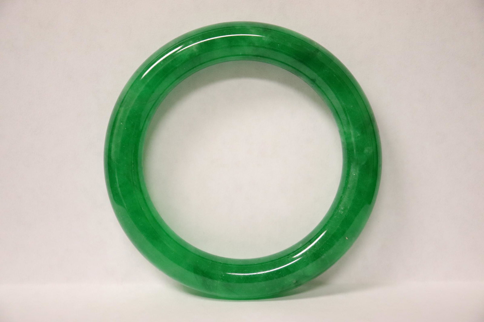 A jadeite like bangle: A jadeite like bangle, 0.45"x3.25"of(2.35"id)