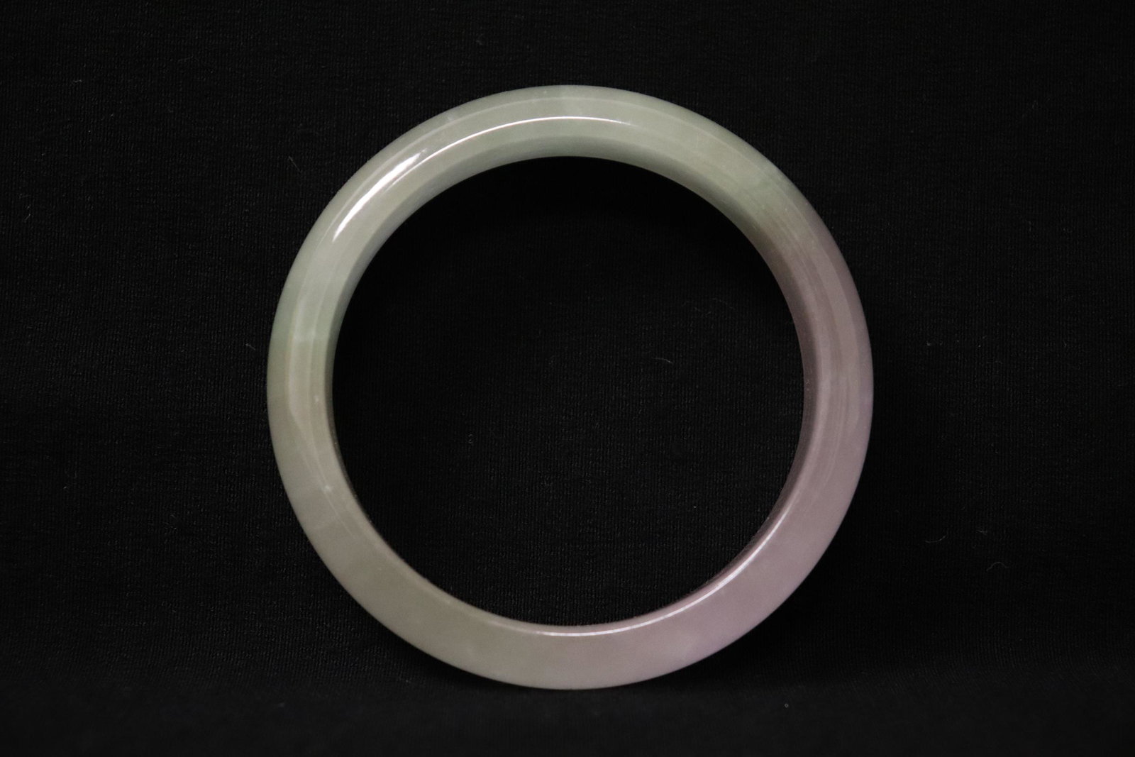 A jadeite like bangle: A jadeite like bangle, 0.6"x2.95"od(2.3"id)