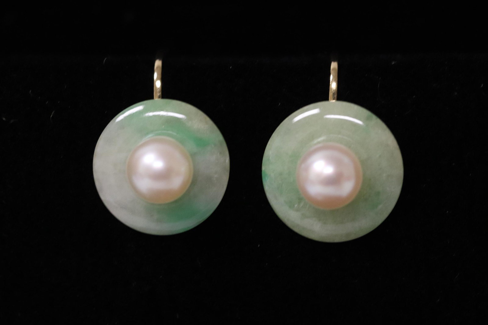 Pair 14K Y/G jadeite and cultured pearl earrings: Pair 14K Y/G jadeite and cultured pearl earrings (0.5"dia each), jadeite disc measures approx. 12.5mm diameter