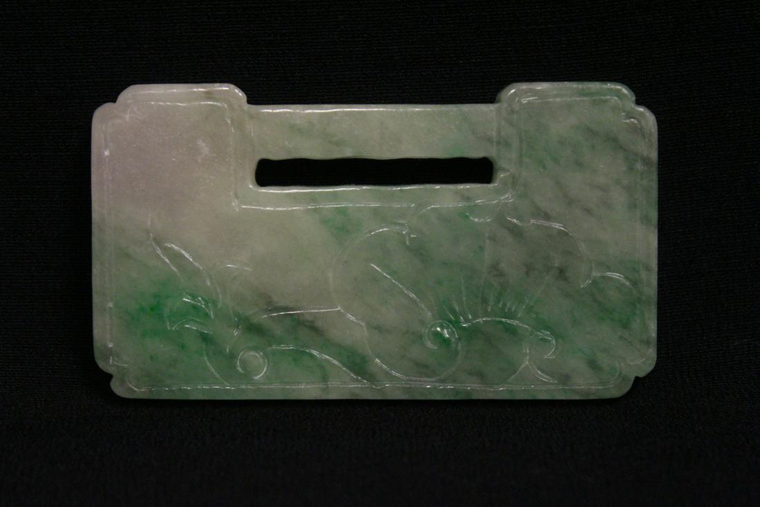 A beautiful apple green jadeite carved locket: A beautiful apple green jadeite carved locket measures approx. 60x37x6.5mm
