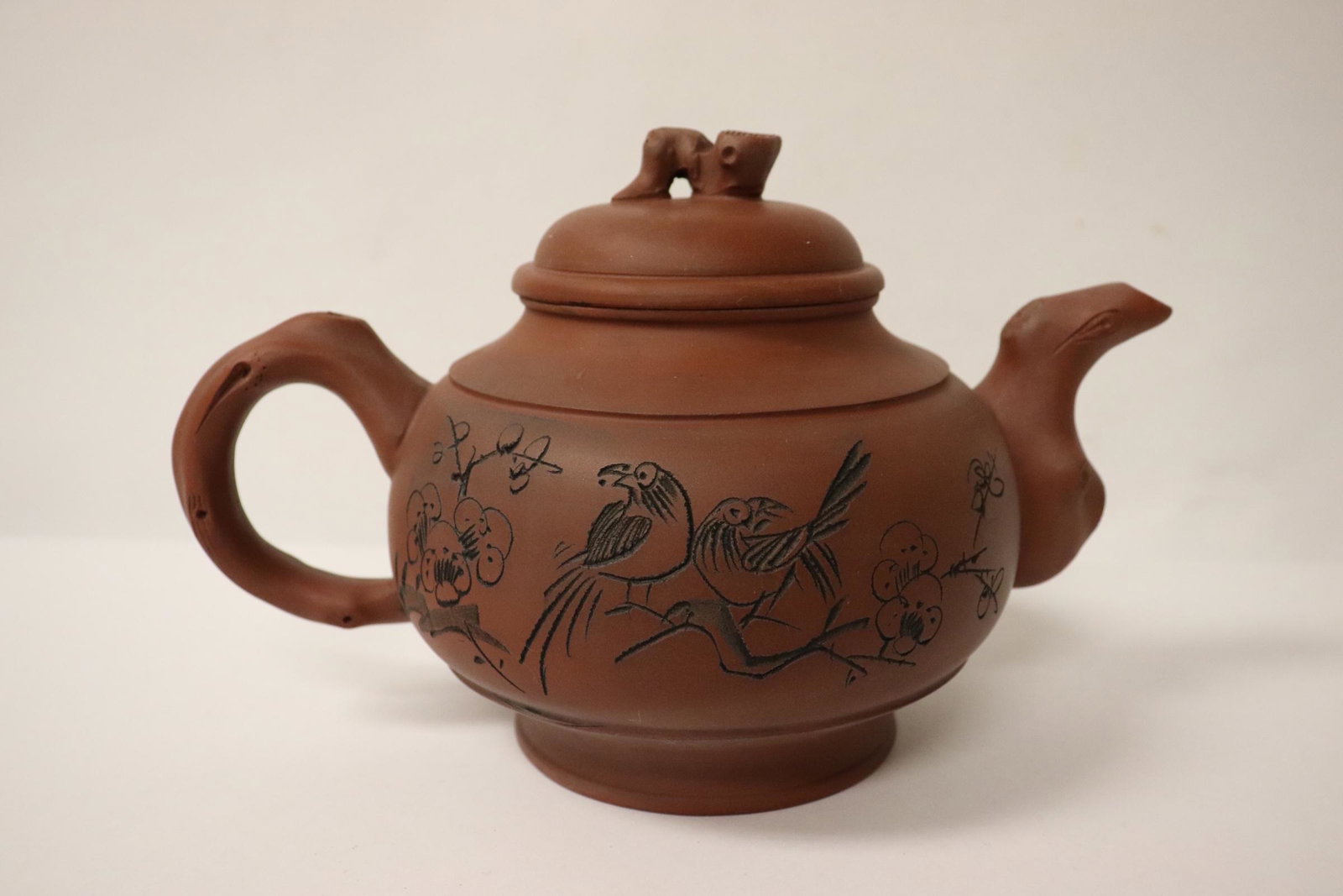 A Yixing teapot with calligraphy: A Yixing teapot with calligraphy, 5.75"Hx9"x5.7"