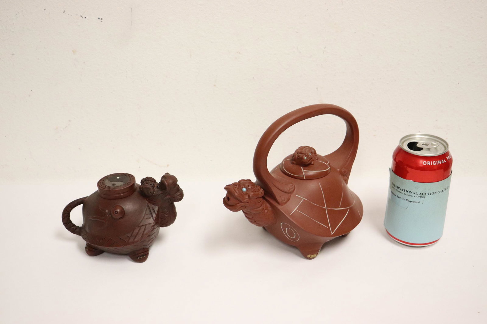 2 Yixing teapots: 2 Yixing teapots, 3.8"Hx5.75"x3.5", 6.85"Hx7.3"x4.9"