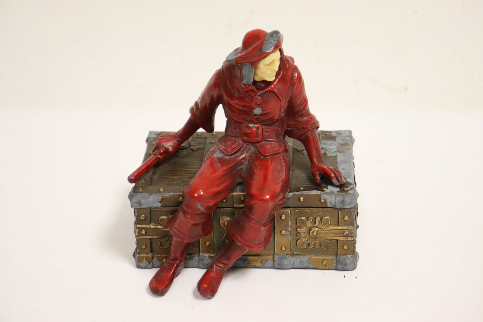 Antique painted metal box with figure, paint chip (1 of 10)