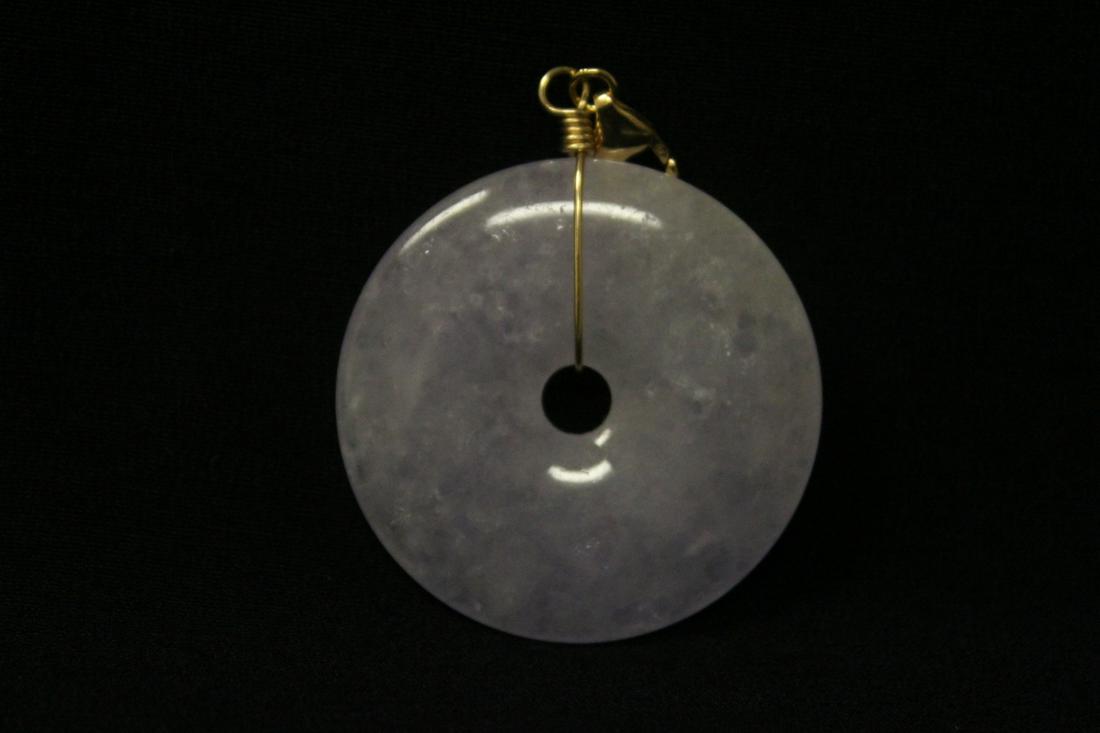 A lavender jadeite disc made as pendant: A lavender jadeite disc made as pendant (0.25"x1.7"dia), measure approx. 40mm diameter