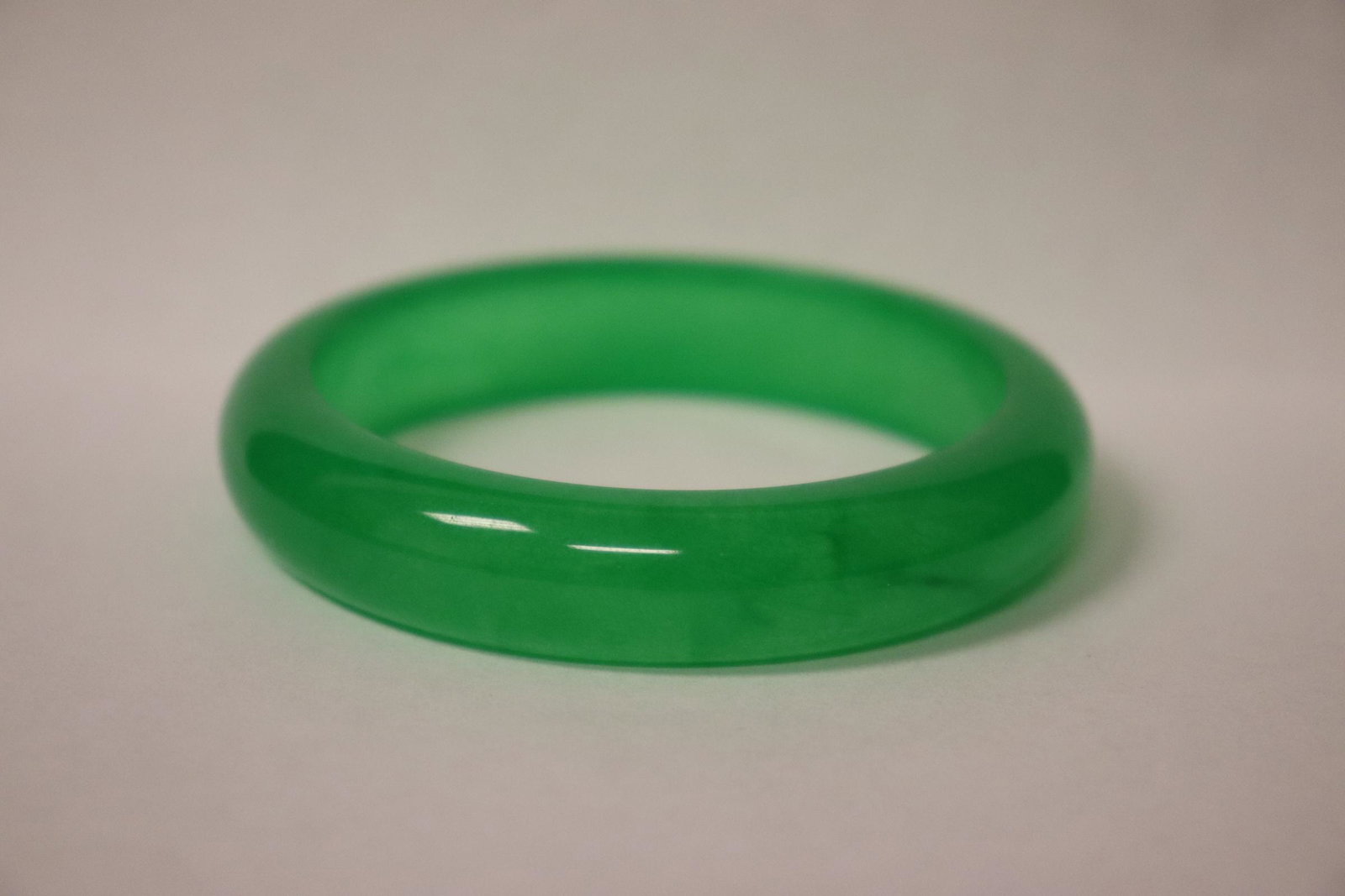 A jadeite like bangle: A jadeite like bangle, 0.6"x3.13"od(2.38"id)
