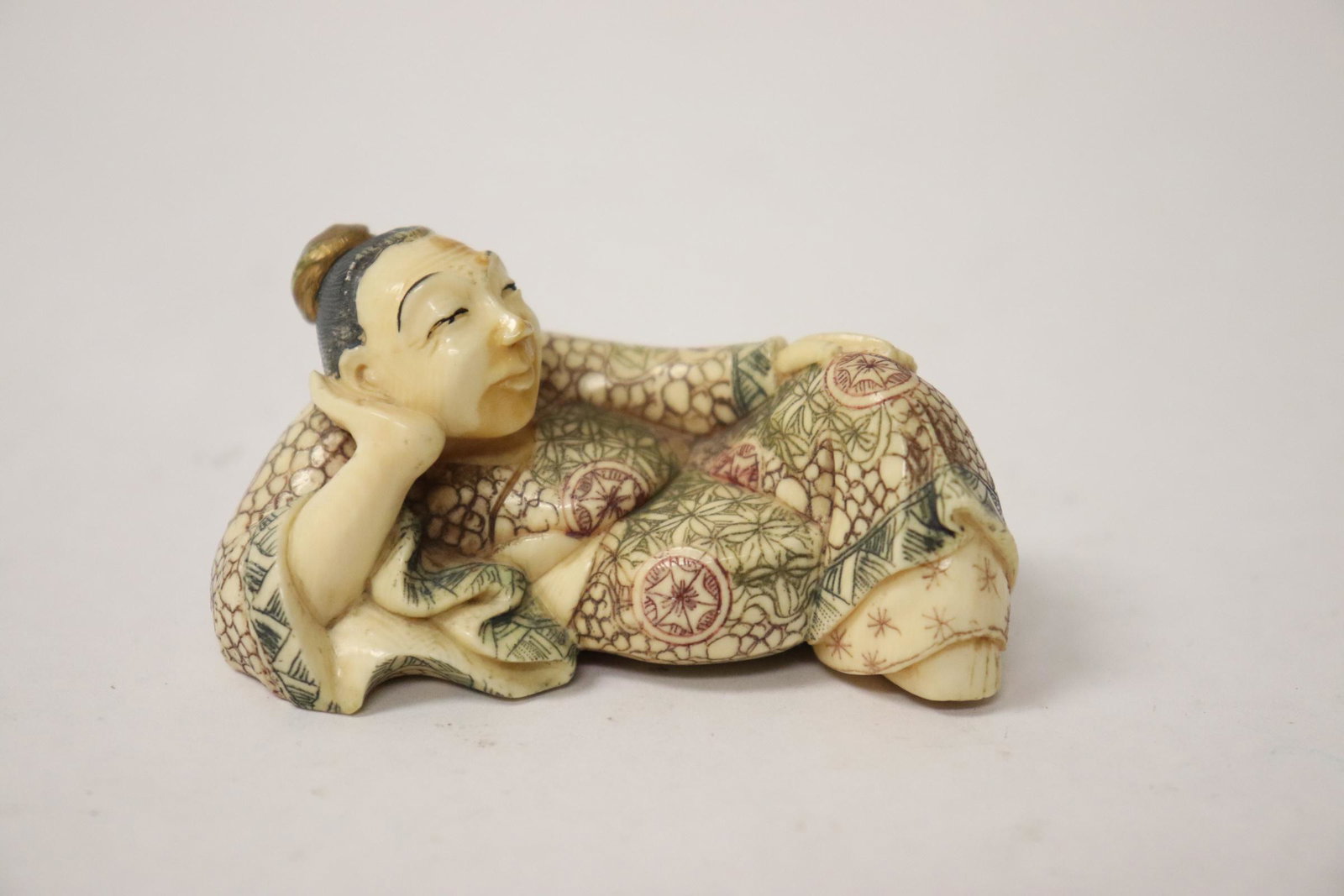 Japanese vintage bone carved netsuke: Japanese vintage bone carved netsuke depicting reclined man, 1.5"H