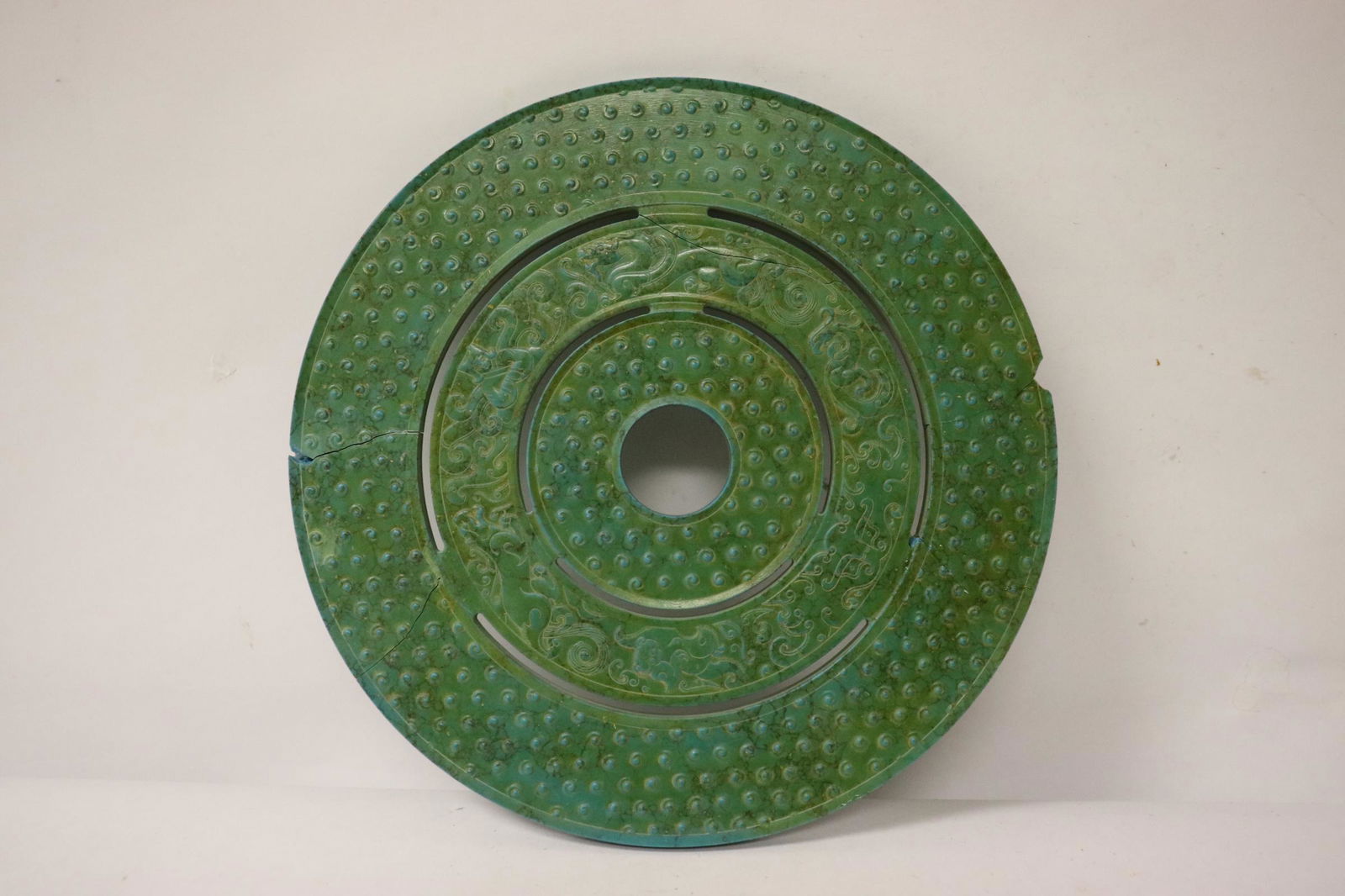 Chinese malachite like stone carved disc: Chinese malachite like stone carved disc, chips and cracks, 0.3"x7.4"dia