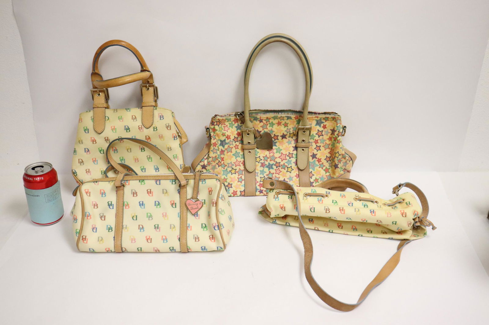 4 Dooney and Bourke coated canvas handbags: 4 Dooney and Bourke coated canvas handbags, all in fine conditions