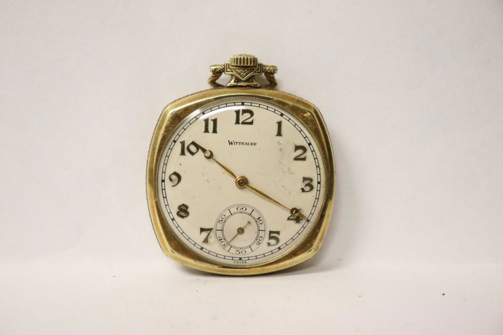 A Wittnauer pocket watch: A Wittnauer pocket watch, 1.95"x1.7"
