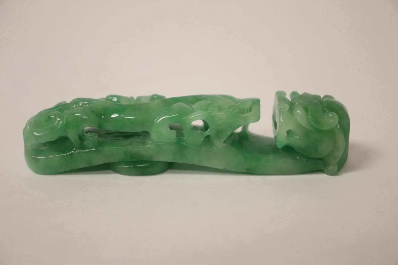 An apple green Chinese jadeite carved belt buckle (1 of 10)
