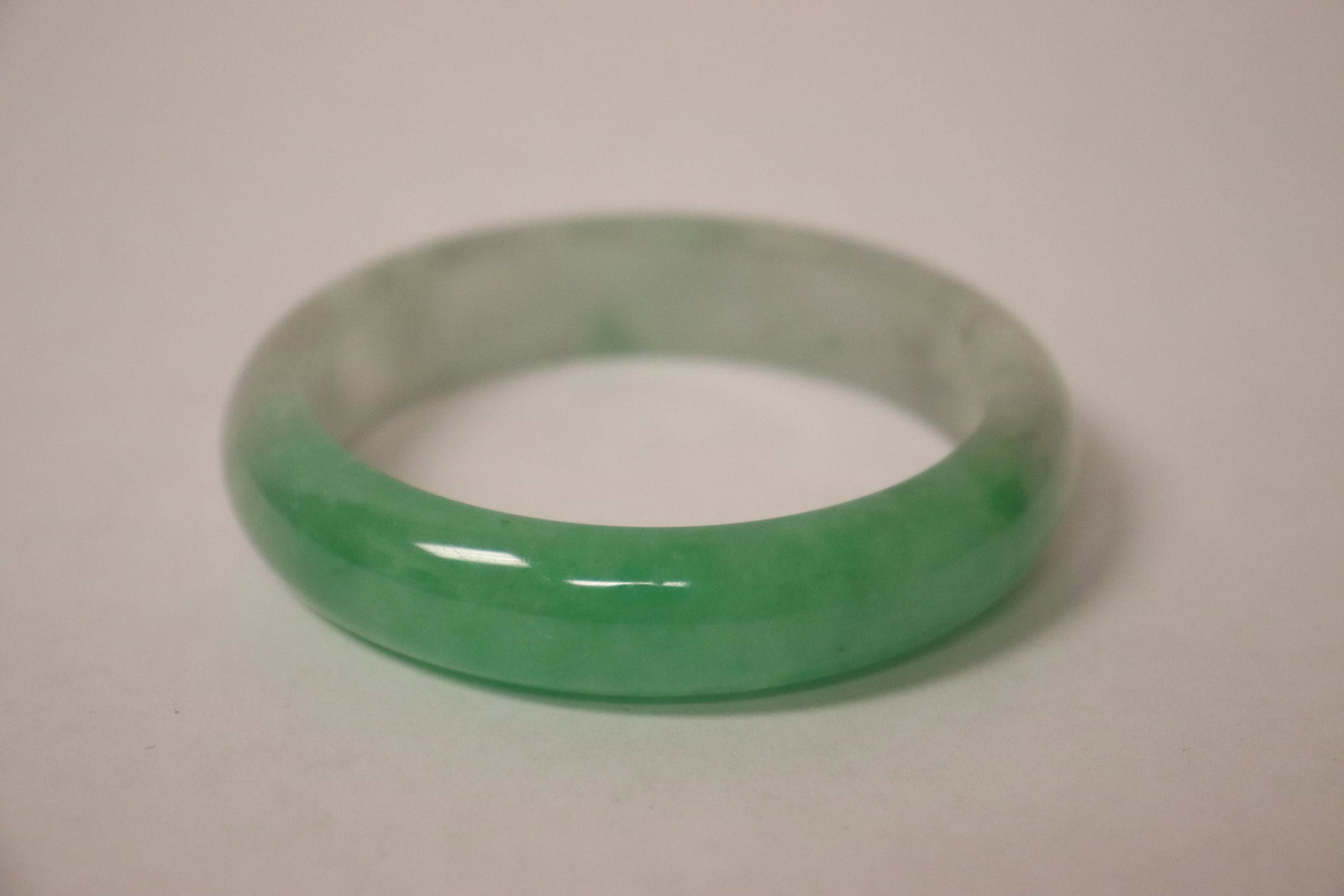 A jadeite like bangle: A jadeite like bangle, 0.63"x3"od(2.3"id)