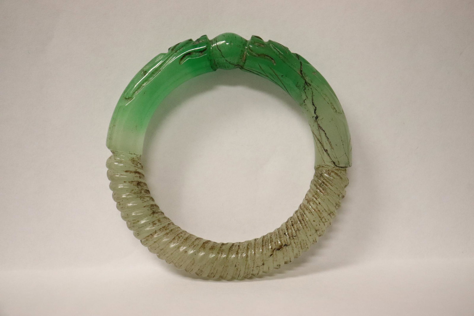 Jadeite like bangle with dragon motif decoration: Jadeite like bangle with dragon motif decoration, 0.5"x3.2"od(2.25"id)