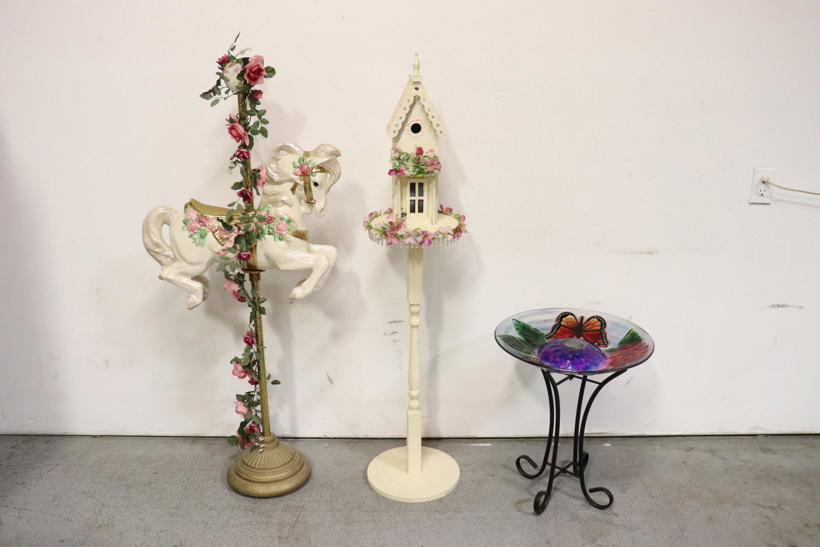 3 items: An art glass bird bath with stand (21.35"Hx18.1"dia), a wood bird feeder (52.75"H), and a decorative porcelain carousel horse (54"H)