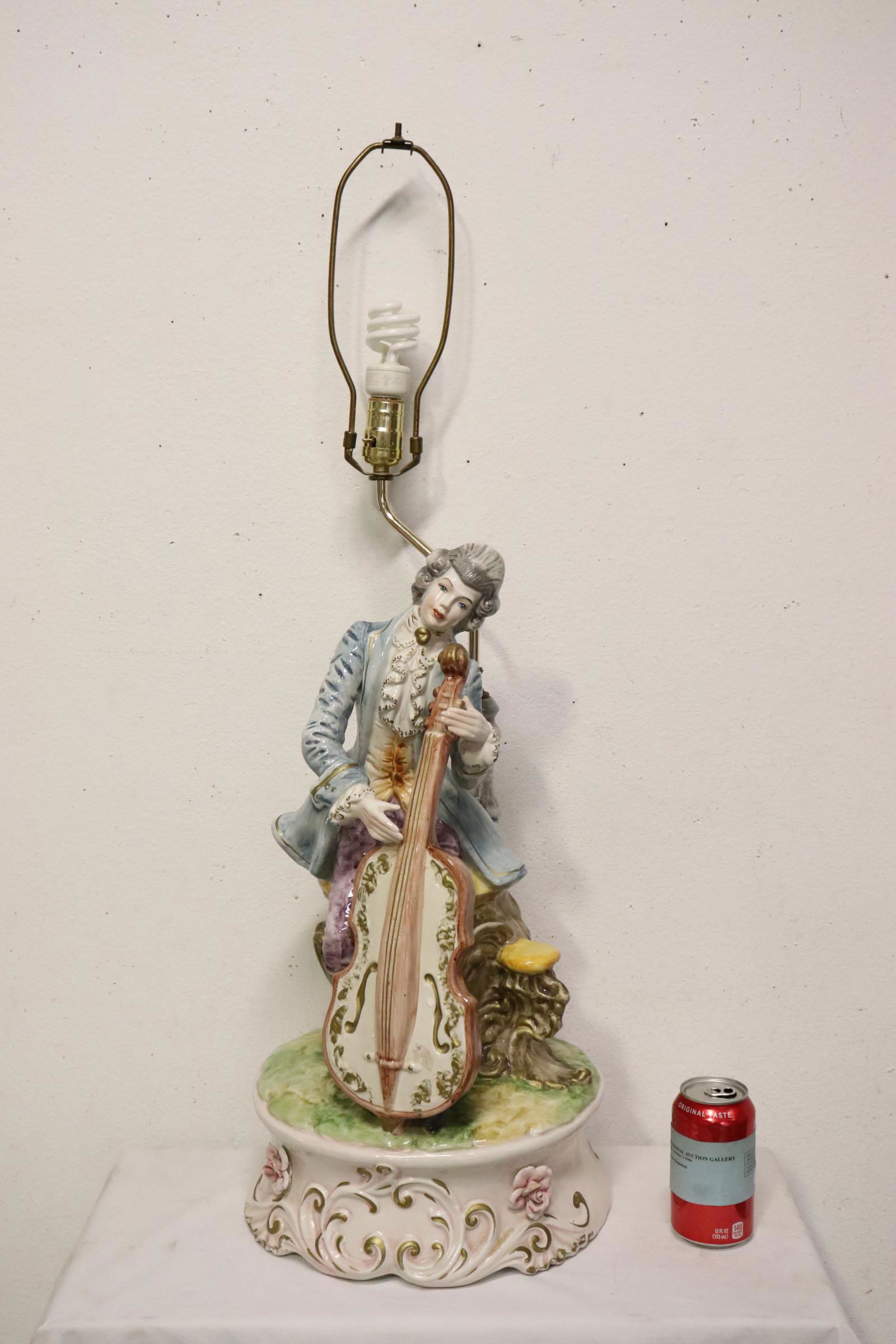 A large capodimonte lamp with musician motif base: A large capodimonte lamp with musician motif base, 35.5"H
