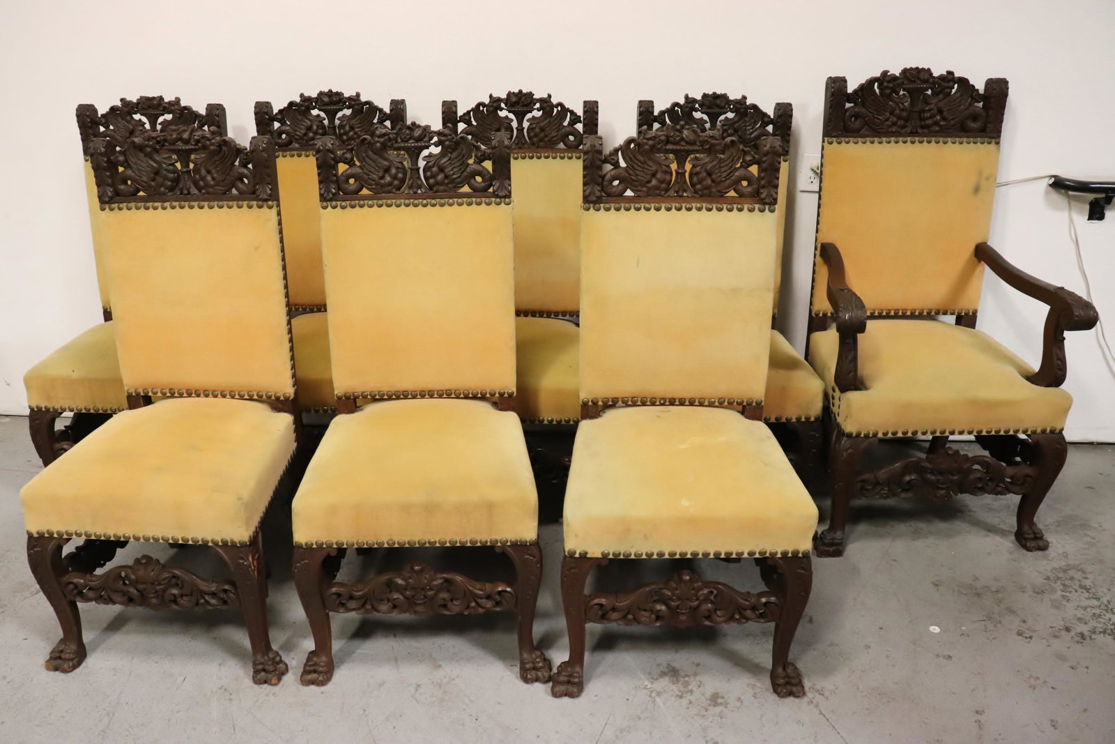 set of eight 19th c. oak heavily carved chairs: Magnificent set of eight 19th century oak heavily carved chairs with griffin motif, 2 of the chair base has minor loss, 46"Hx20.3"x21.3"(7), 49"Hx27"x24.5"