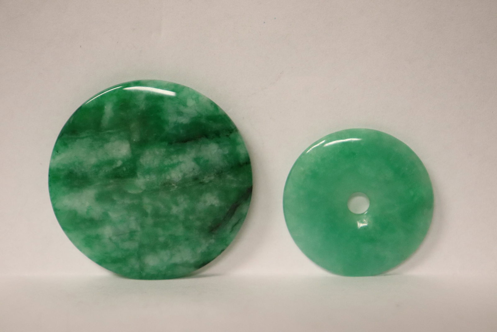 2 jadeite like disc: 2 jadeite like disc, 0.38"x1.88"dia, 0.18"x1.38"dia