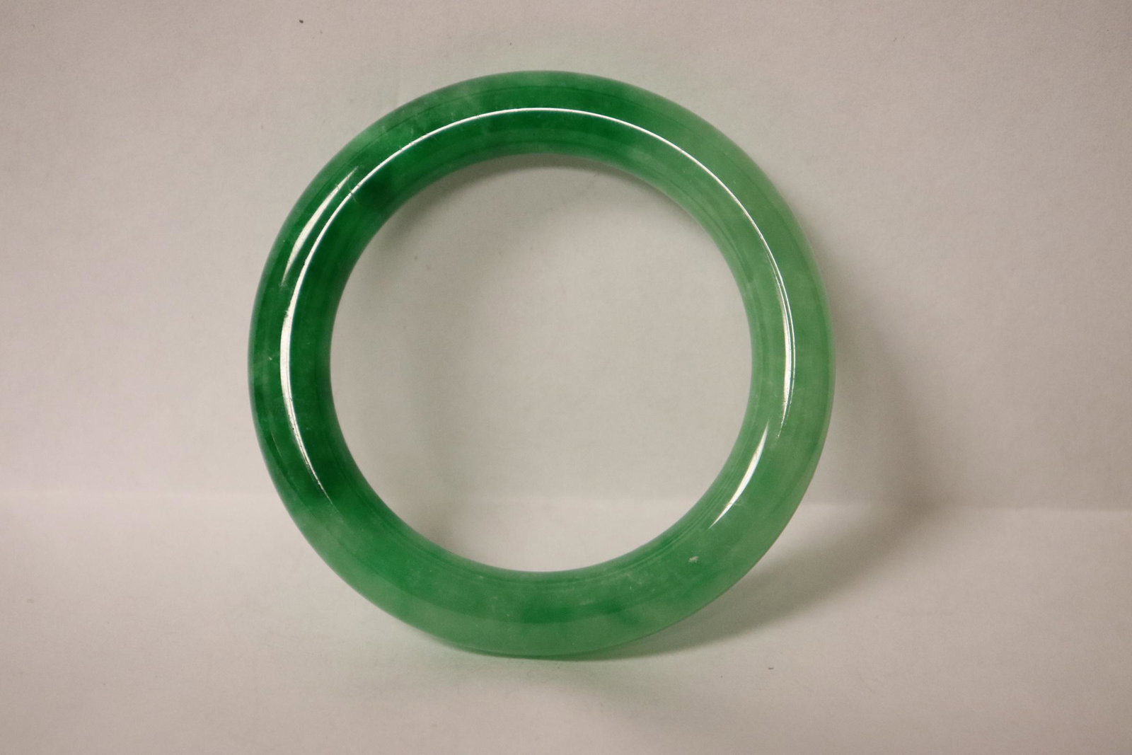 A jadeite like bangle: A jadeite like bangle, 0.43"x3.05"od(2.2"id)