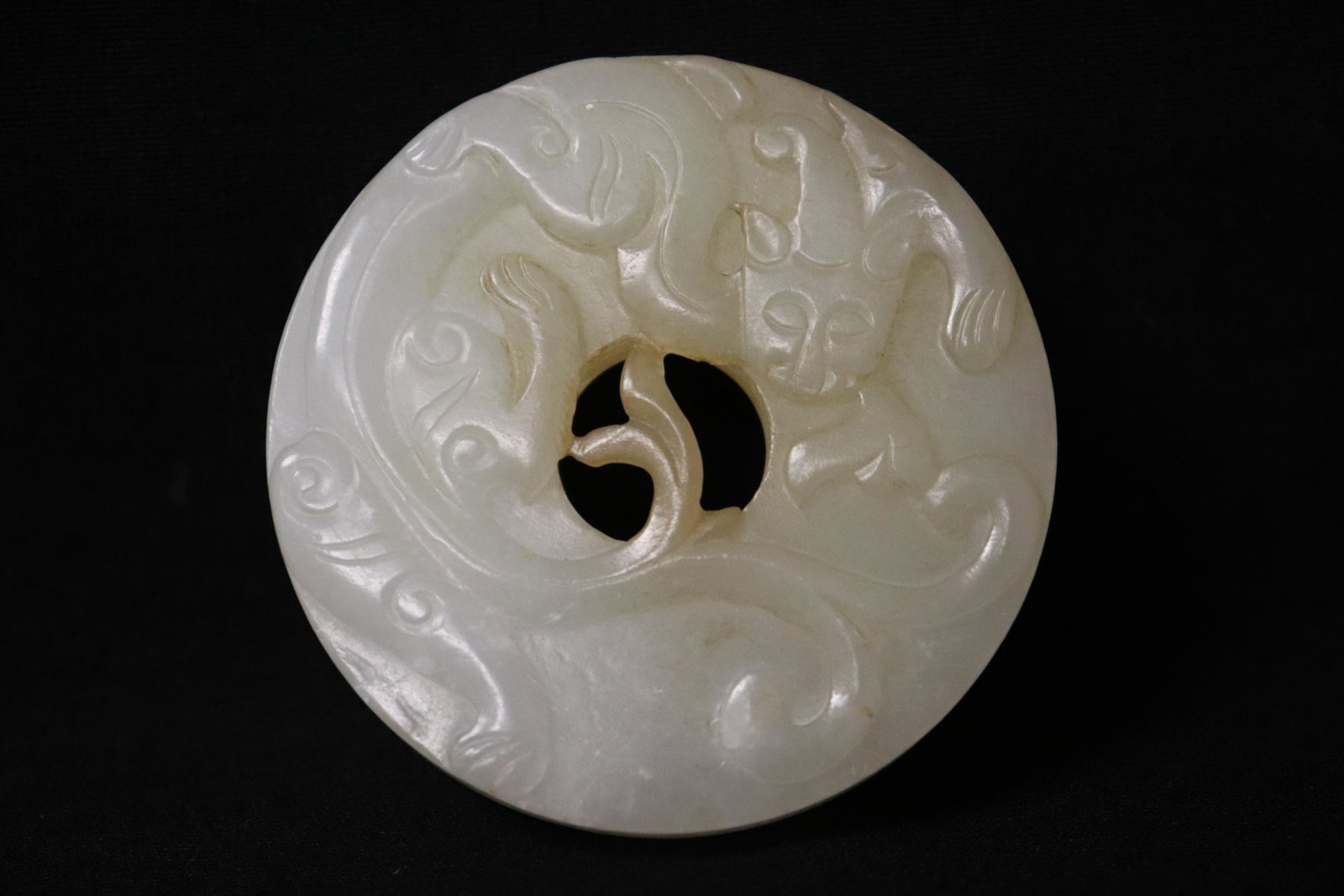 Very fine Chinese white jade carved disc: Very fine Chinese white jade carved disc, 0.35"x2.15"dia