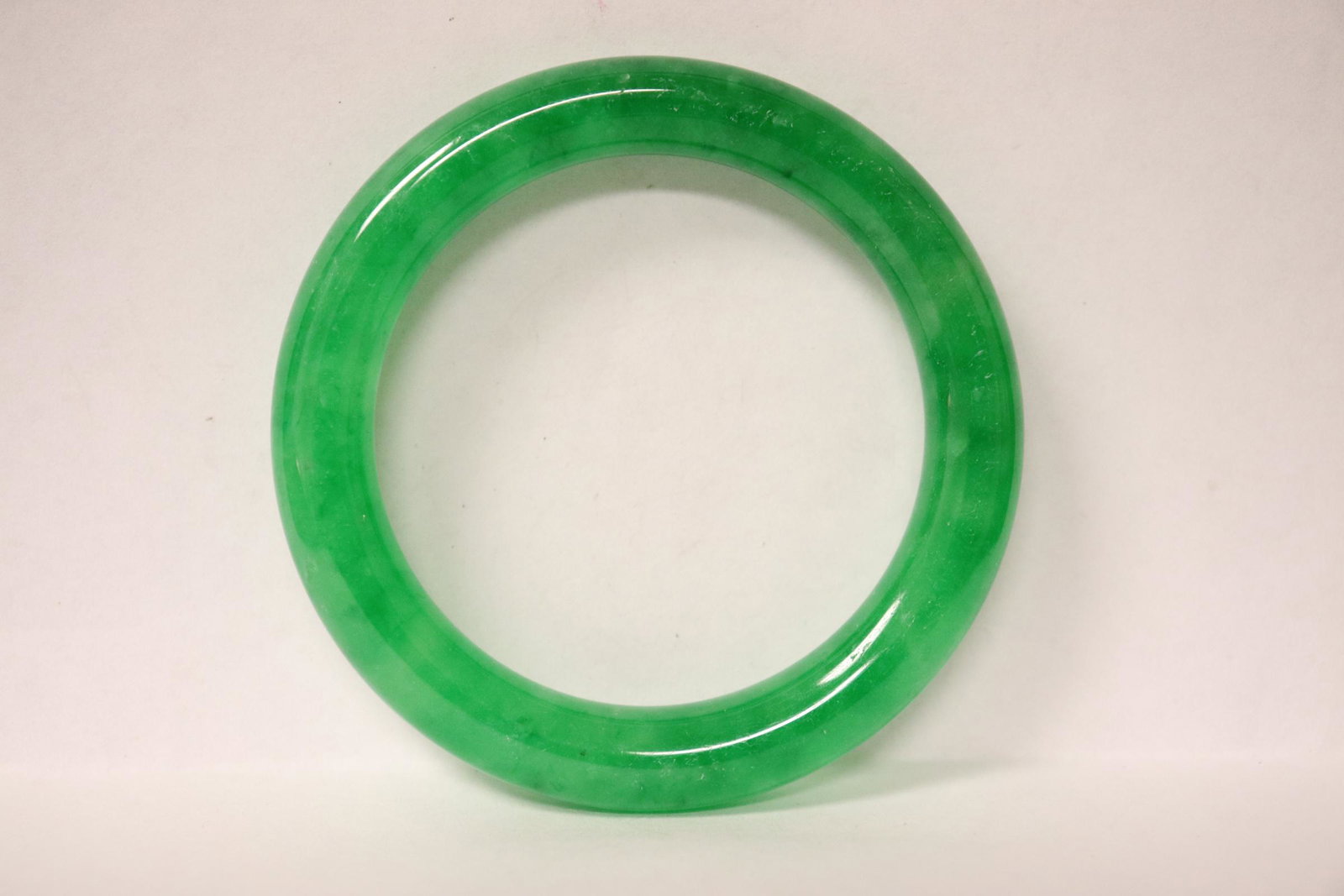 A jadeite like bangle: A jadeite like bangle, 0.35"x2.85"od(2.05"id)