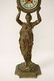 Gilt metal table clock with figure motif base - 2
