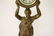 Gilt metal table clock with figure motif base - 3