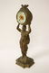 Gilt metal table clock with figure motif base - 5