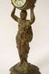Gilt metal table clock with figure motif base - 6