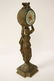 Gilt metal table clock with figure motif base - 7