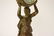 Gilt metal table clock with figure motif base - 8