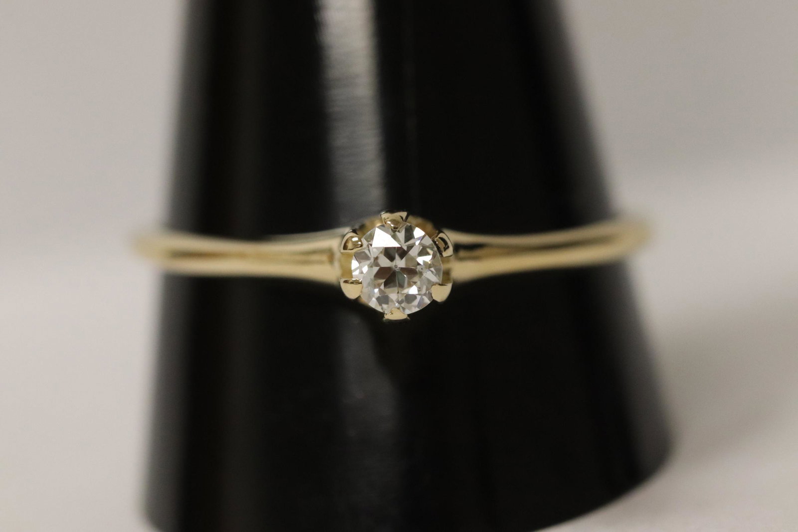 14K Y/G diamond ring: 14K Y/G diamond ring, center an European cut diamond wt. approx. 0.35ct, size 11