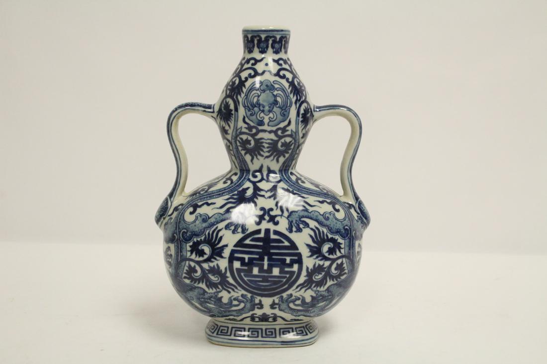Chinese blue and white porcelain flask: Chinese blue and white porcelain flask, 9.35"Hx6.4"x3.7"